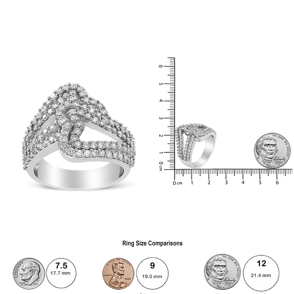 White metal ring with multiple rows of round white gemstones in prong settings forming a crisscross design, shown from the front. Second image shows the ring from a side angle placed on a scale with a coin beside it for size reference.