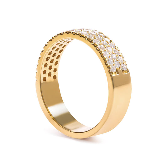 Yellow metal ring with three rows of round white pave-set gemstones, shown at an angled side view.