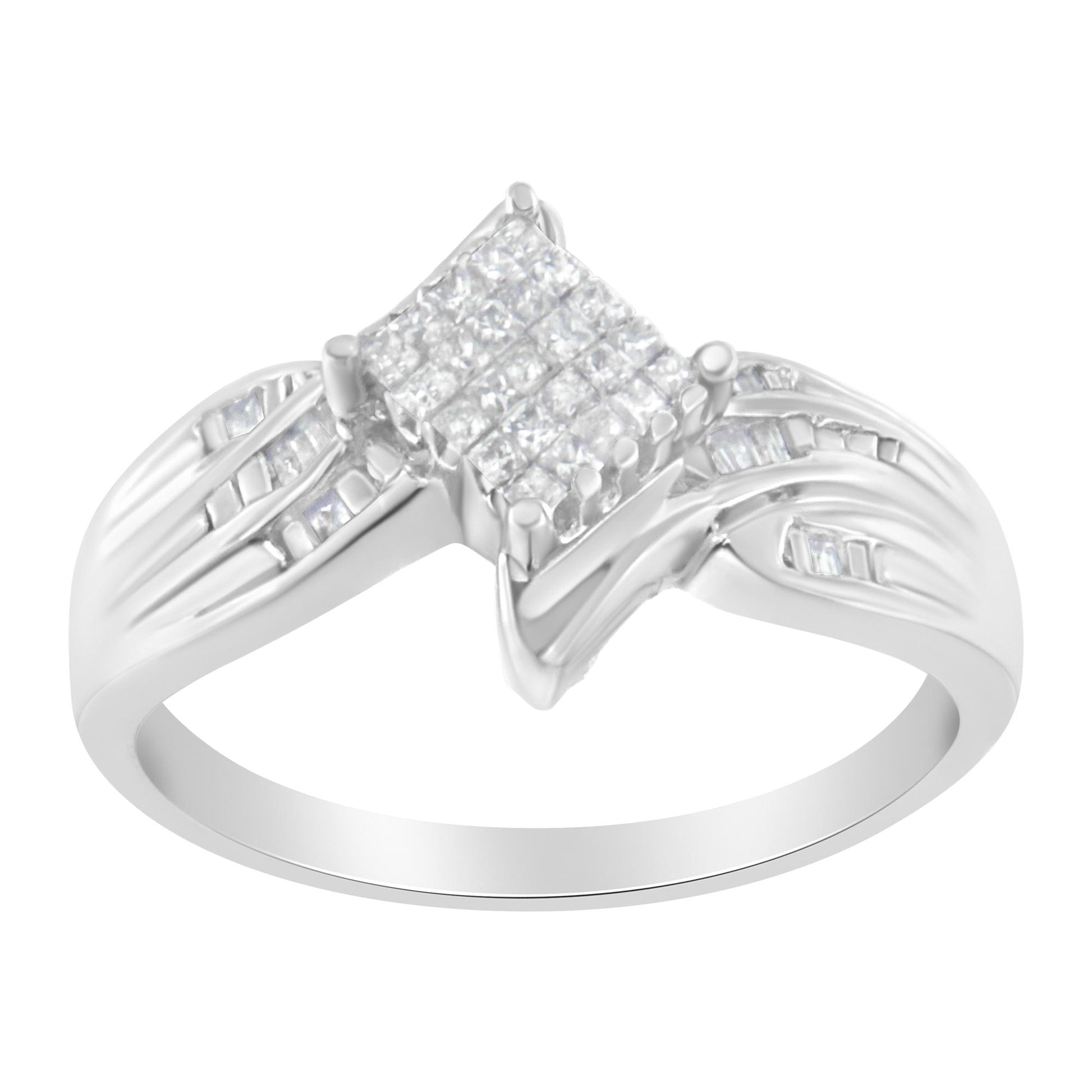 White metal ring shown at an angled top view, featuring a square cluster of white gemstones in prong setting at the center, flanked by channel-set baguette-shaped white gemstones on the split band.
