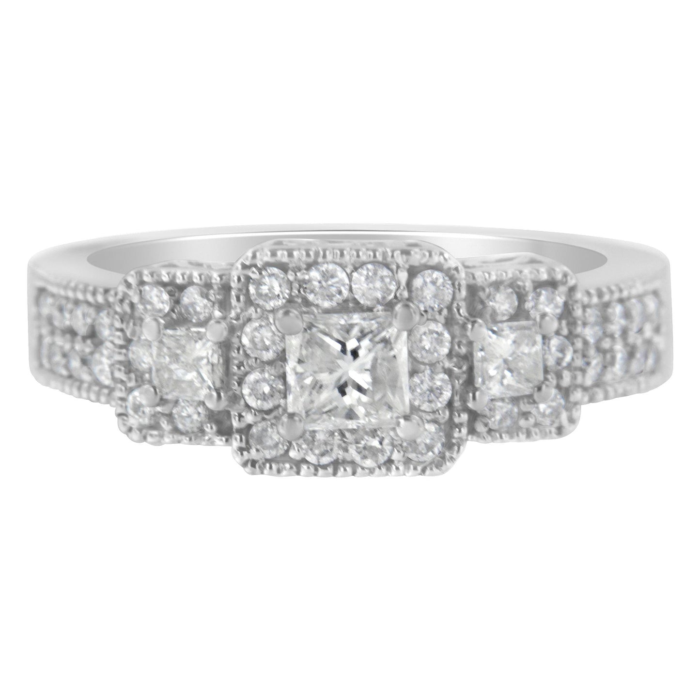 Front angle of a white ring featuring one central princess-shaped gemstone, flanked by two smaller princess-shaped gemstones, all surrounded by multiple round white gemstones in prong settings.