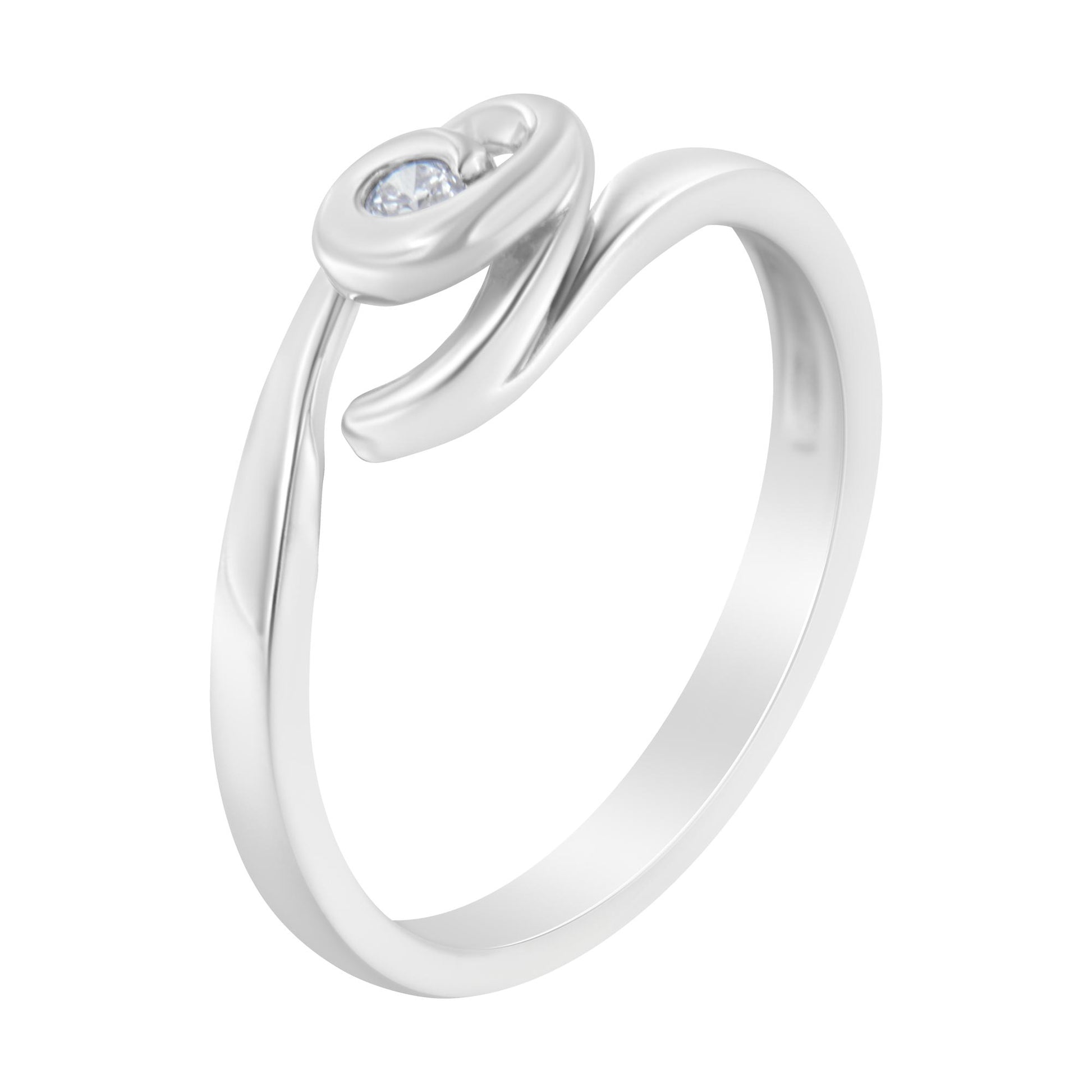 White metal ring with a single round white gemstone in a bezel setting, shown at a slight angled view.