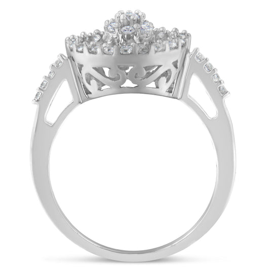 Front angle of a white metal ring featuring a cluster of prong-set round white gemstones at the center, surrounded by channel-set baguette-shaped white gemstones along the band.