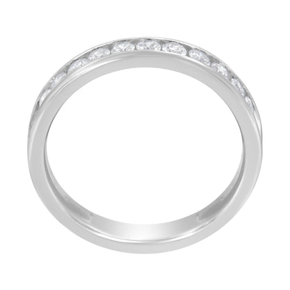 Top-down view of a white ring with a channel setting of round white gemstones encircling half the band.