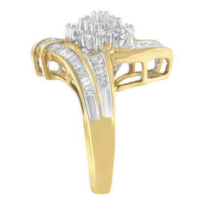 Yellow metal ring with a cluster of round white gemstones in prong settings on top, flanked by rows of channel-set baguette white gemstones along the sides, shown from a side angle.