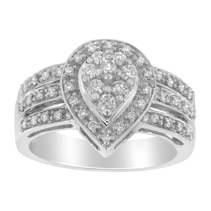 Front-facing shot of a white ring featuring a pear-shaped cluster of white round gemstones in a pave setting, surrounded by a halo of smaller white round gemstones, with additional rows of white round gemstones along the band.