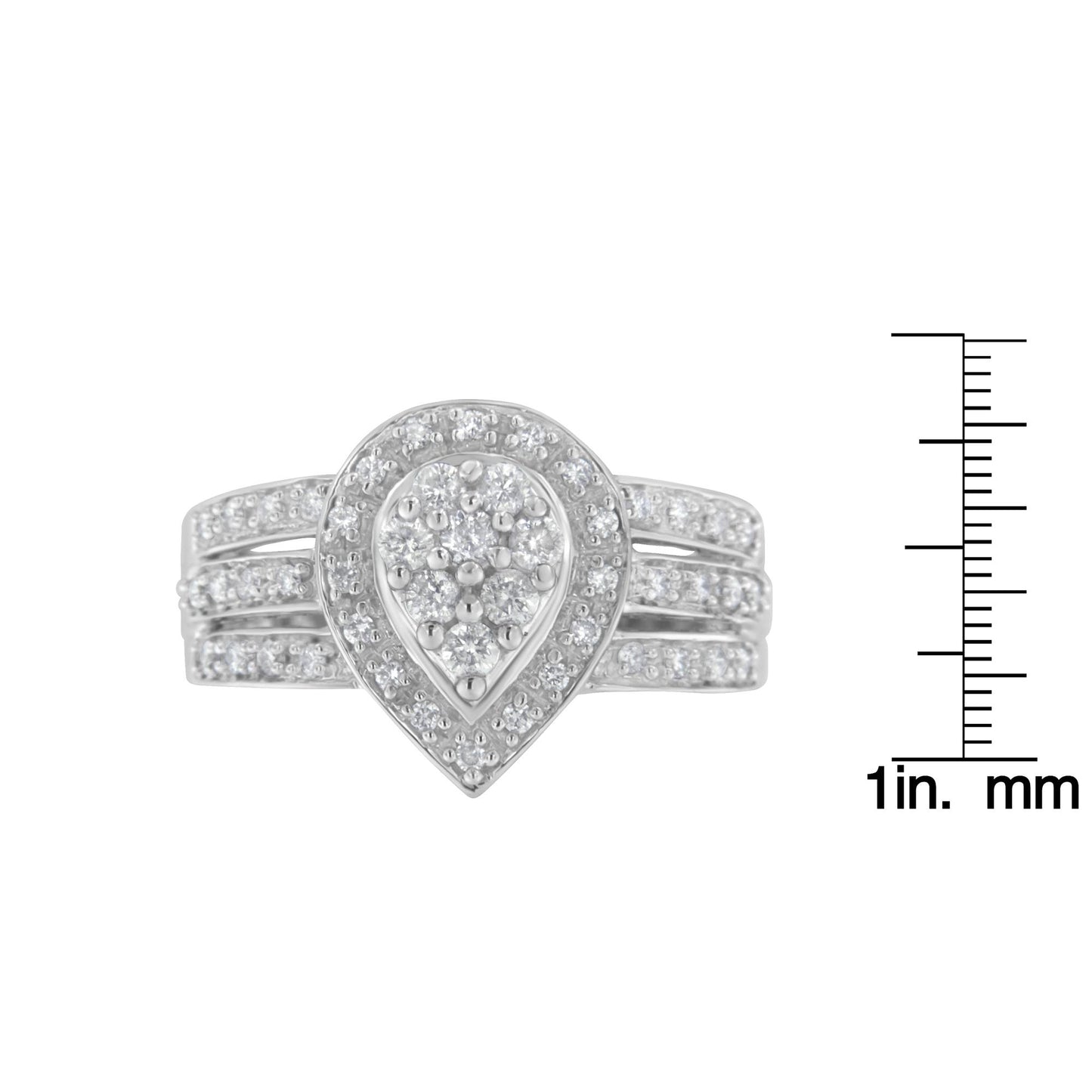 Front view of a white metal ring with a teardrop-shaped cluster of round white gemstones in pave setting, displayed next to a scale for size reference.