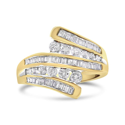 Yellow metal ring with alternating rows of round and baguette white gemstones in channel settings, shown at an angled close-up.