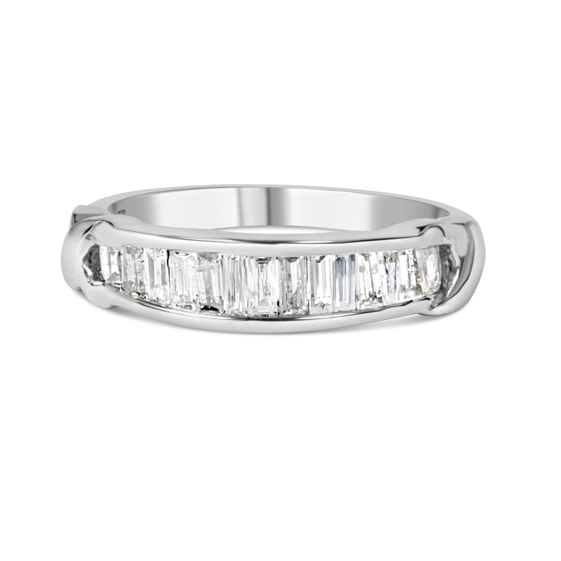 Front angle of a white metal ring featuring a channel setting with aligned baguette-shaped white gemstones.