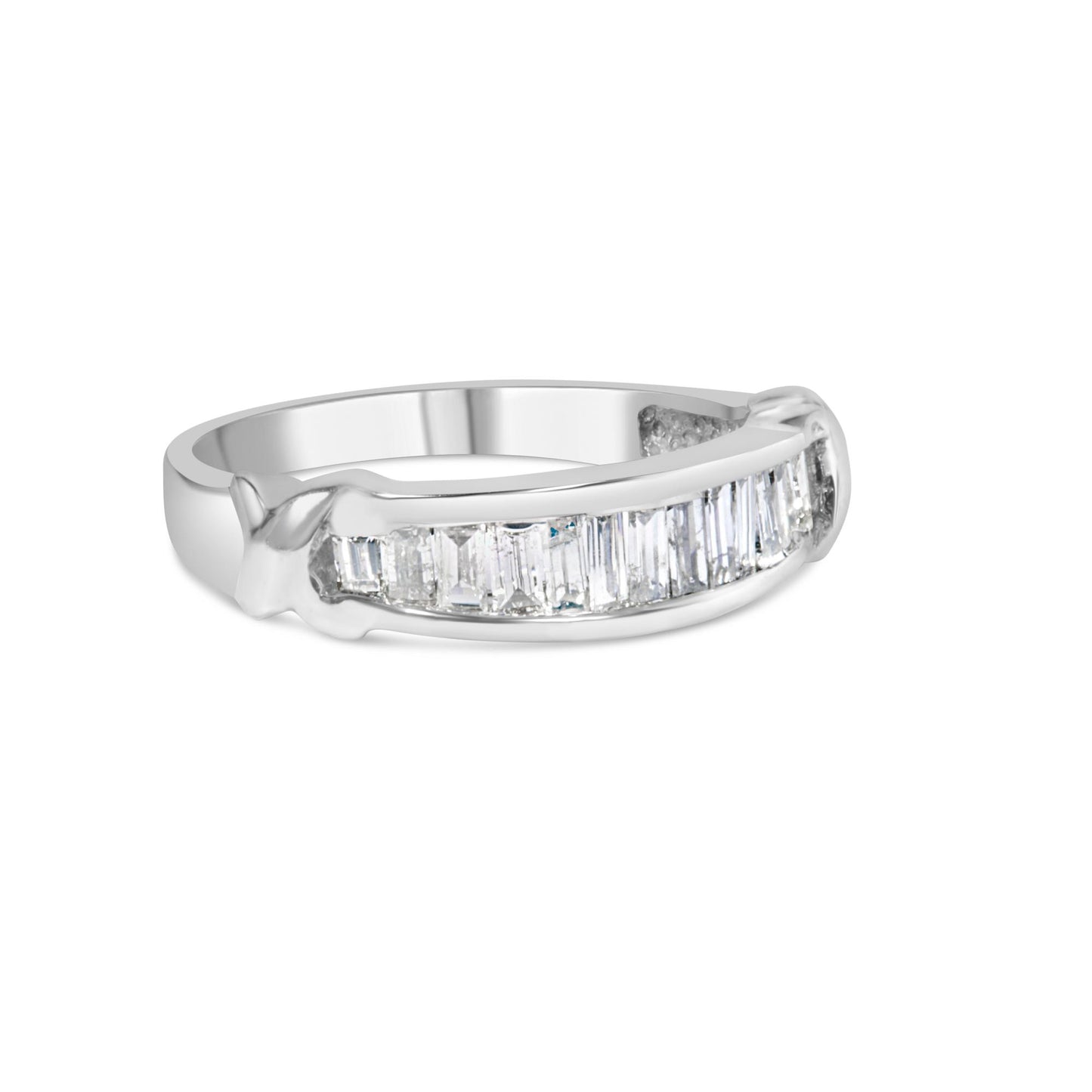 White metal ring with a row of channel-set baguette-shaped white gemstones, shown at a slight angle.