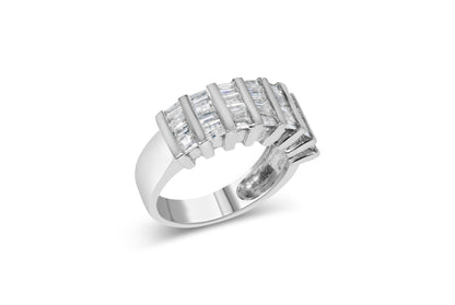 White metal ring with an open design featuring rows of channel-set baguette-shaped white gemstones, shown at a slight angle.