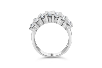 White jewelry ring with a curved row of channel-set white baguette-shaped gemstones, shown from a front angle on a white background.