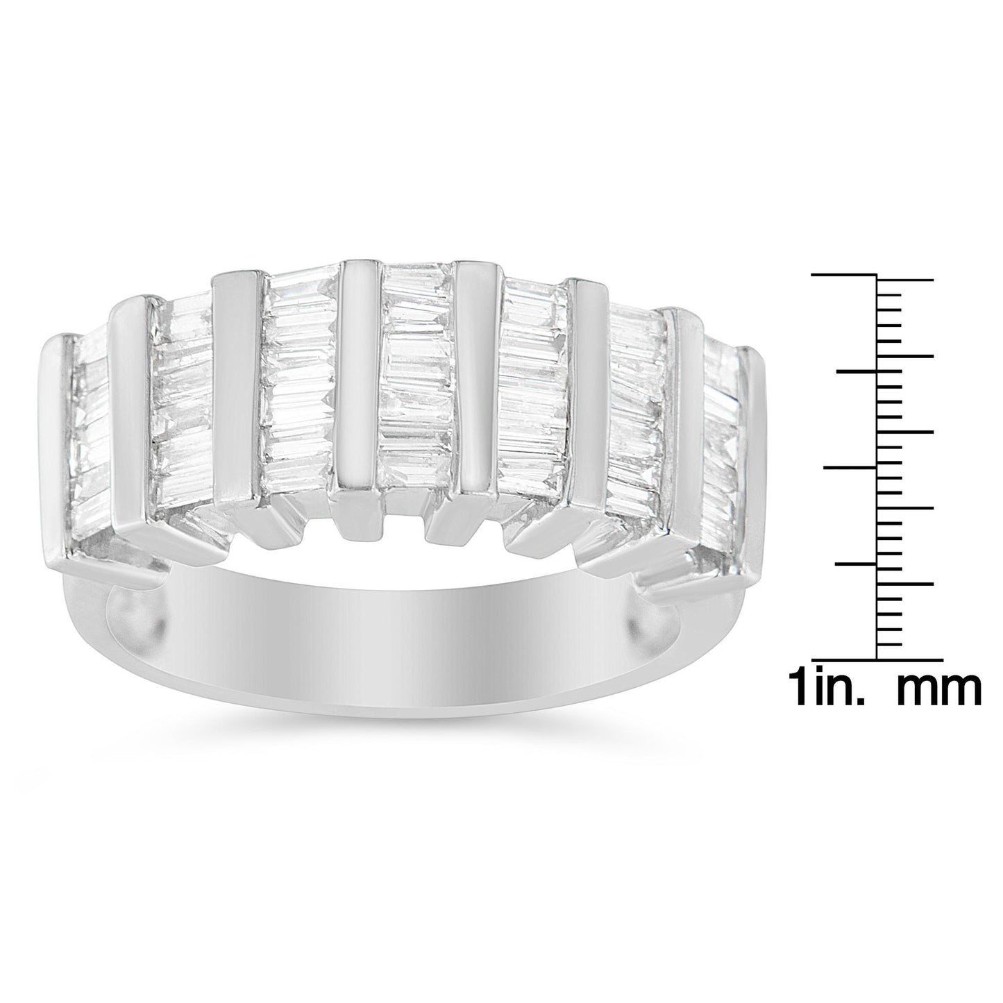 White metal ring with multiple rows of vertically set baguette-shaped white gemstones in a channel setting, shown from a front angle, placed next to a ruler for size reference.