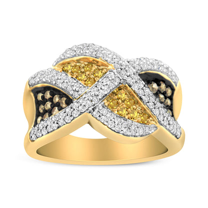 Yellow metal ring with an intricate crisscross design featuring multiple small white, champagne, and yellow gemstones, shown in a front close-up angle.
