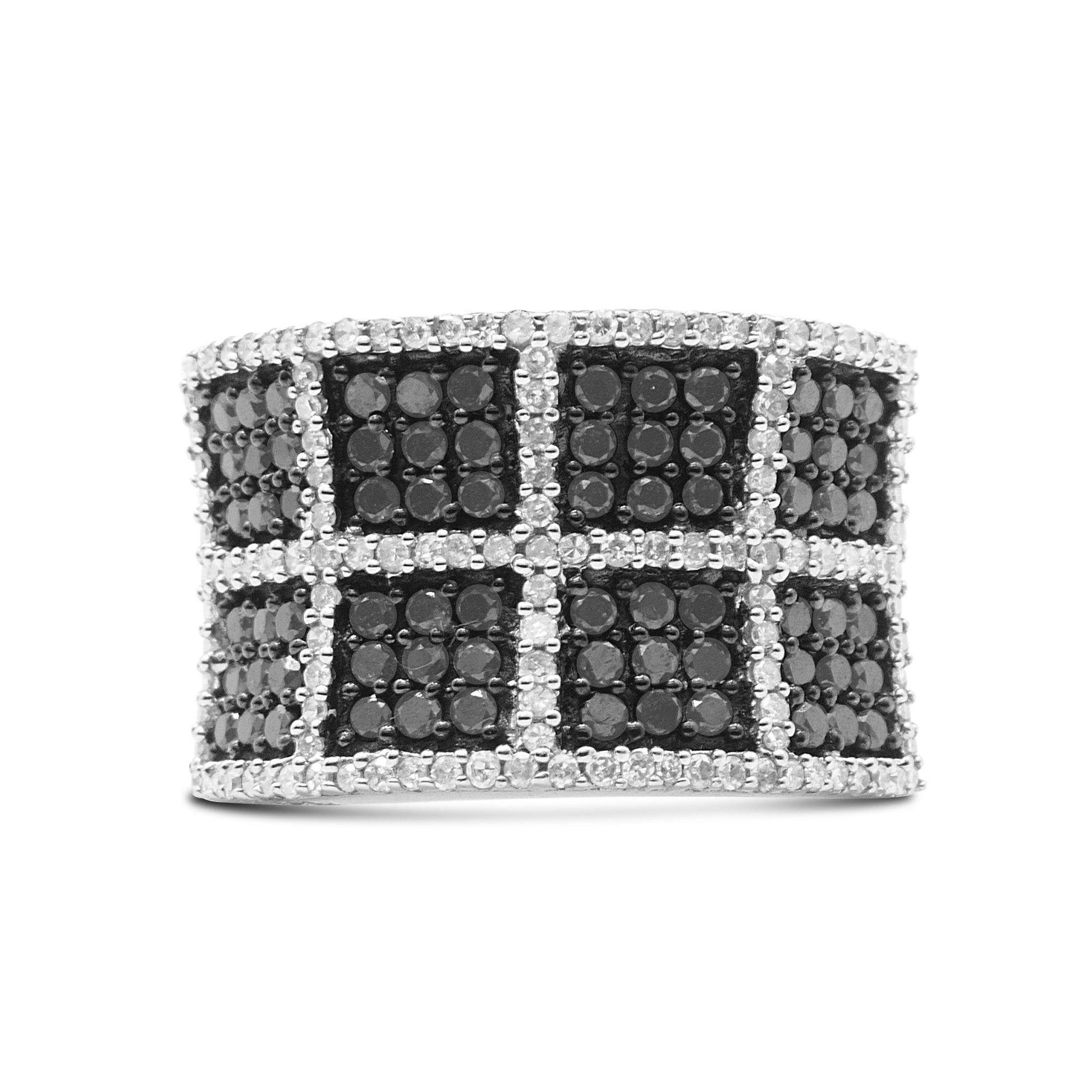Front view of a wide white metal ring featuring a grid pattern of prong-set white gemstones and pave-set black gemstones.