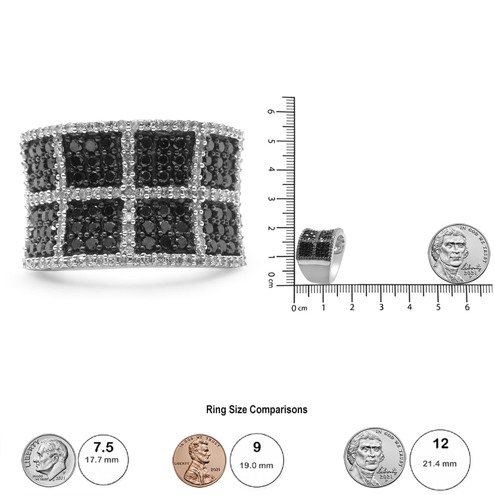 White metal ring with black and white round gemstones in prong and pave settings in a grid pattern, shown from a front angle on a ruler for size reference.