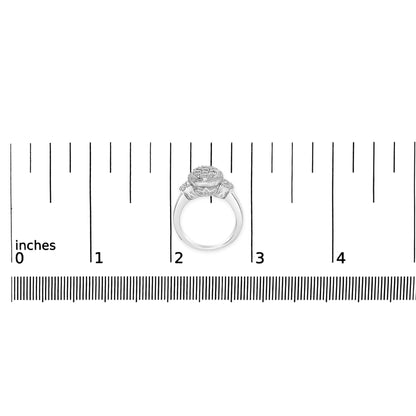 White metal ring with round and baguette shaped white gemstones in prong and channel settings, shown from front on a ruler for size reference.