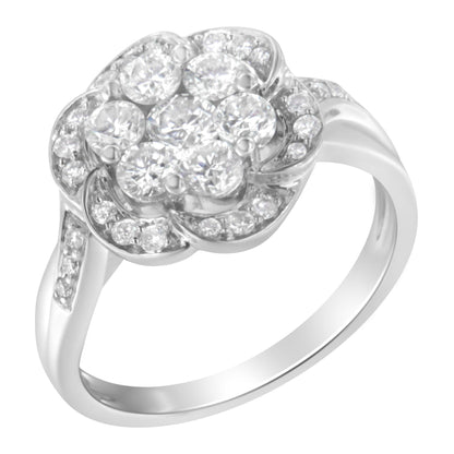 White metal ring with a floral cluster of round white gemstones in prong settings, shown at an angled top view.