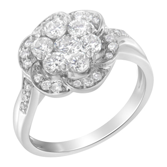 White metal ring with a floral cluster of round white gemstones in prong settings, shown at an angled top view.
