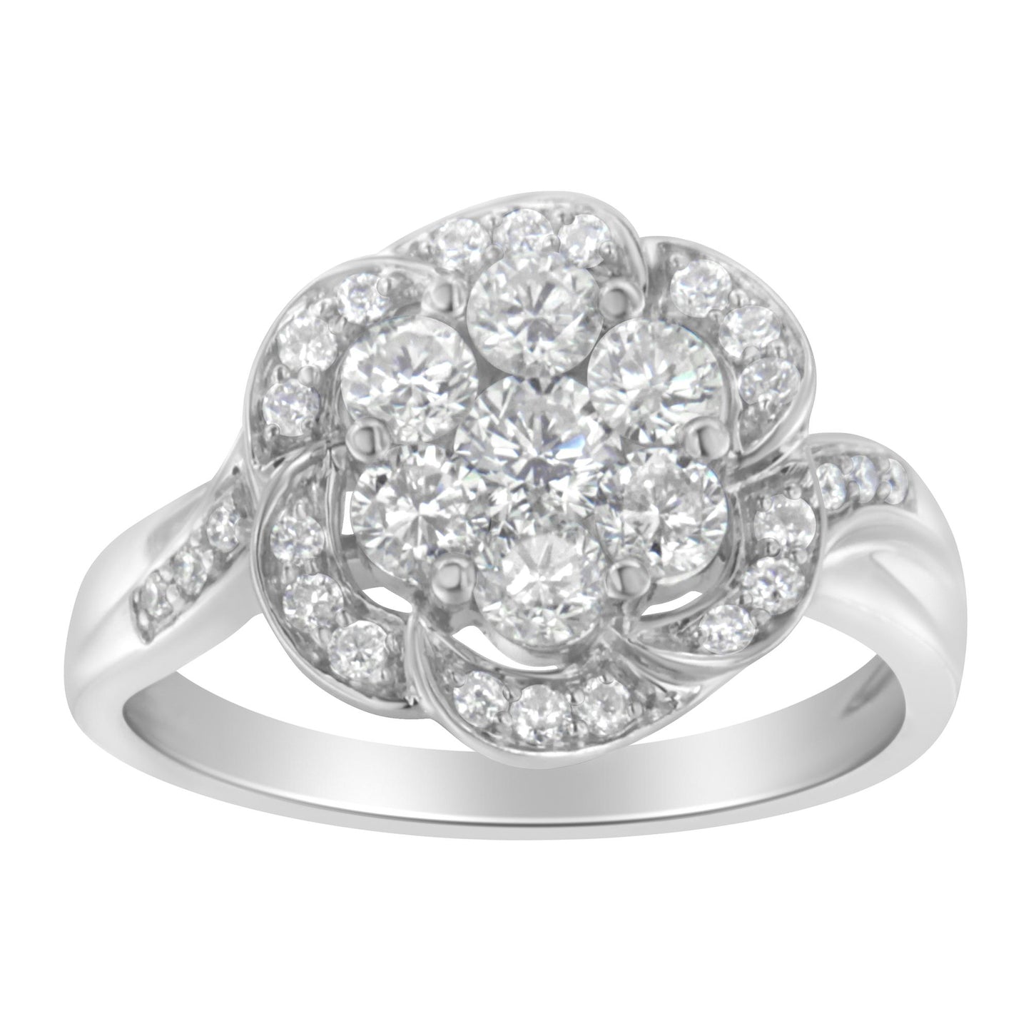 Front angle view of a white metal ring featuring a flower-shaped cluster of round white gemstones in prong settings, with additional smaller round white gemstones decorating the petals and band.