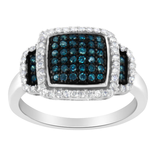 White metal ring with a three-section rectangular top, center and sides featuring blue and white round pave-set gemstones, shown from a front angle.