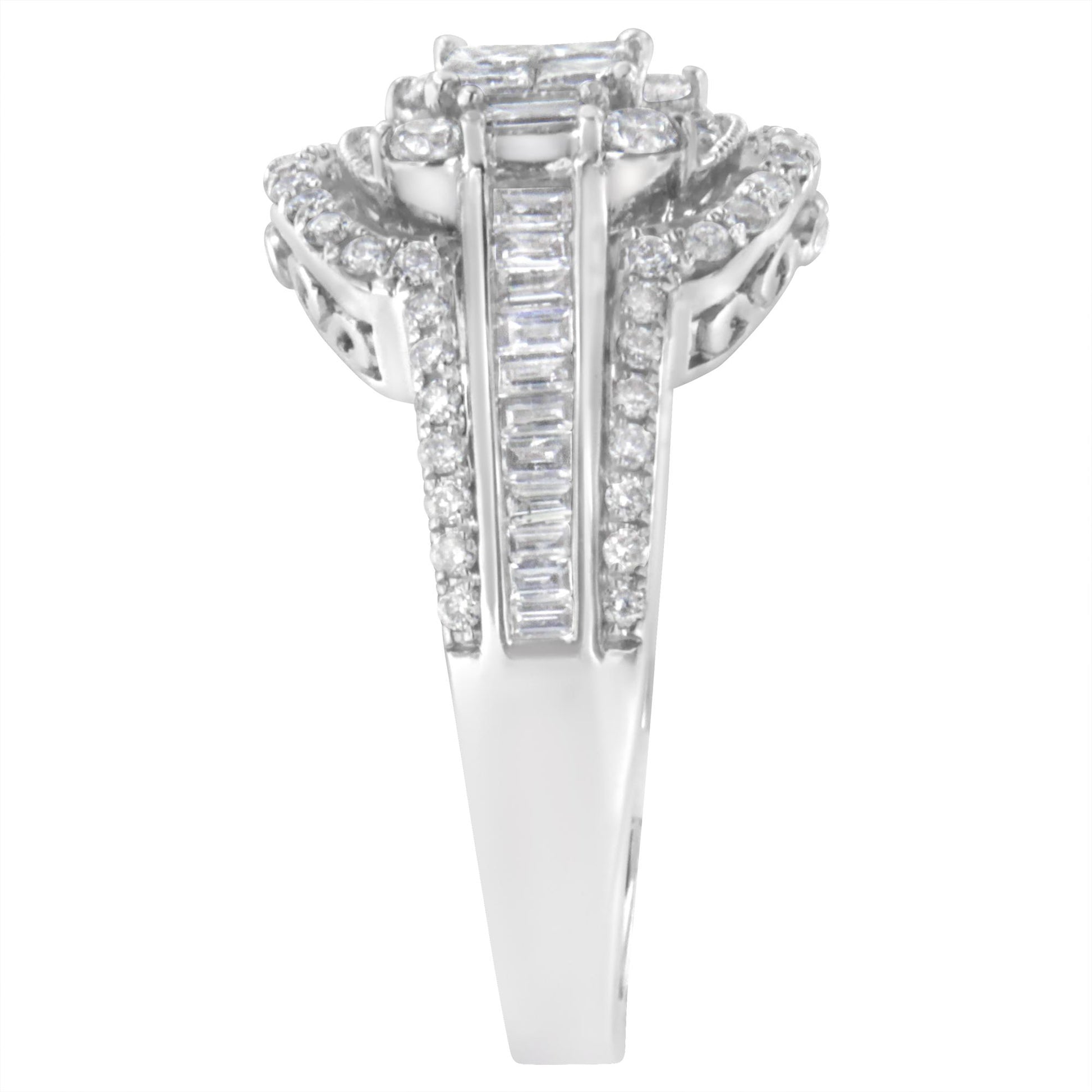 Top view of a white metal ring featuring round gemstones in a pave setting around the band edges, baguette gemstones in a channel setting down the center, and princess-shaped gemstones in an invisible setting at the top.