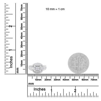 White metal ring with multiple white gemstones in round, baguette, and princess shapes, shown from the front on a ruler scale for size reference.