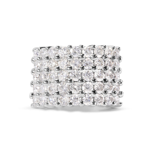 Close-up front view of a wide white metal ring featuring multiple rows of round white gemstones in a prong setting.