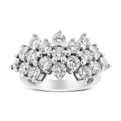 White metal ring with multiple round white gemstones in prong settings, shown from the front angle.