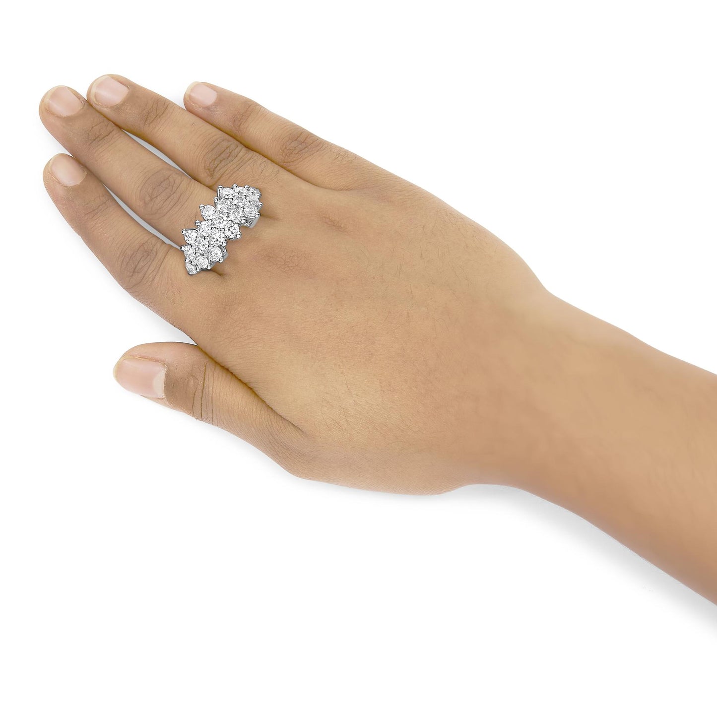 White metal ring with multiple round white gemstones in prong settings, worn on a model's finger, side angle view.