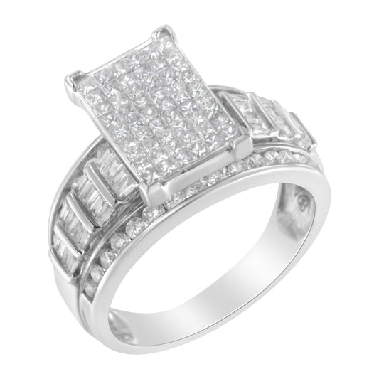 Close-up angled view of a white metal ring featuring a rectangular cluster of princess cut white gemstones in an invisible setting on top, with rows of baguette and round white gemstones set in channels along the band.