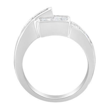 Side view of a white metal ring featuring channel-set white princess and baguette shape gemstones.