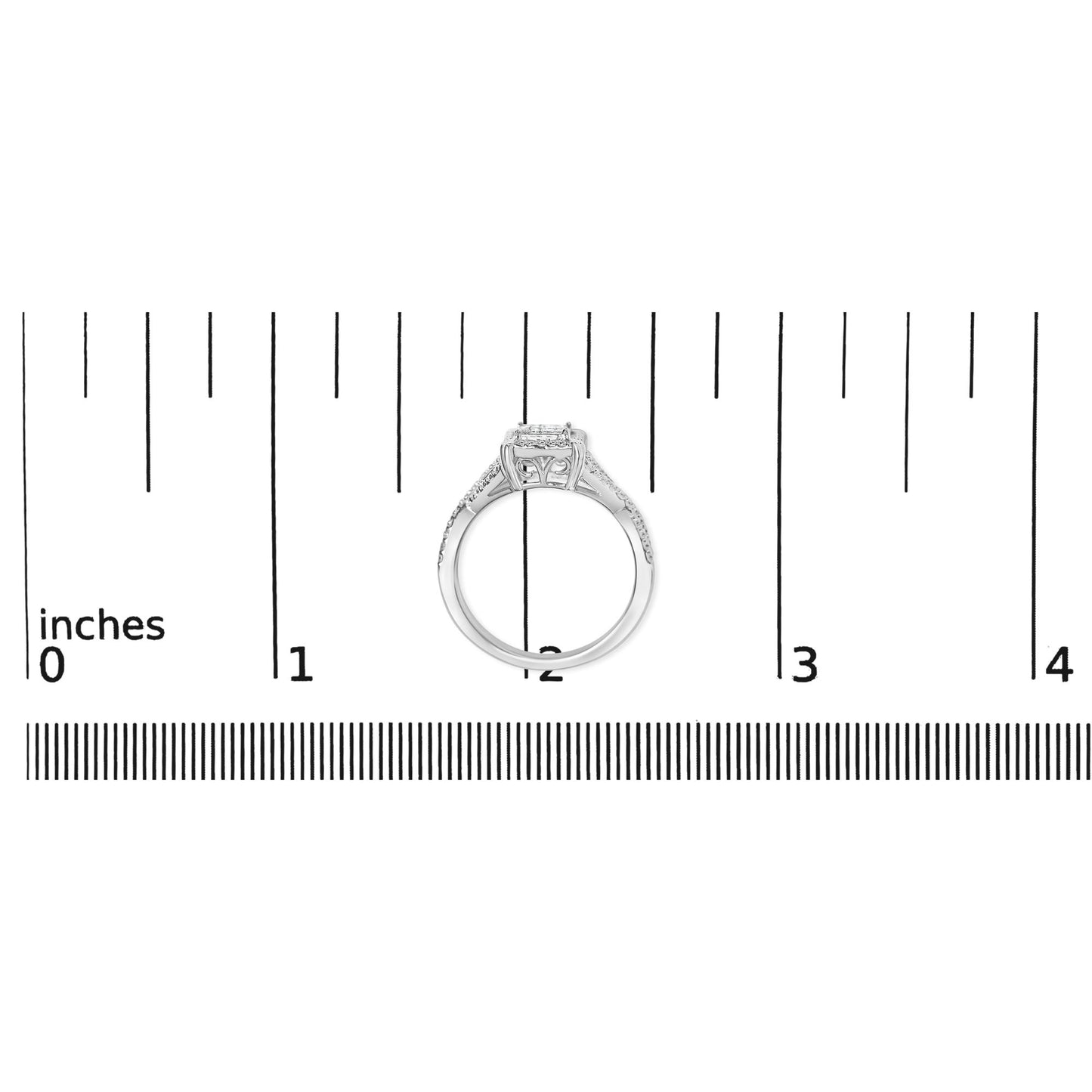 Top view of a white metal ring with princess shape white gemstones in an invisible setting, placed on a ruler for size reference.