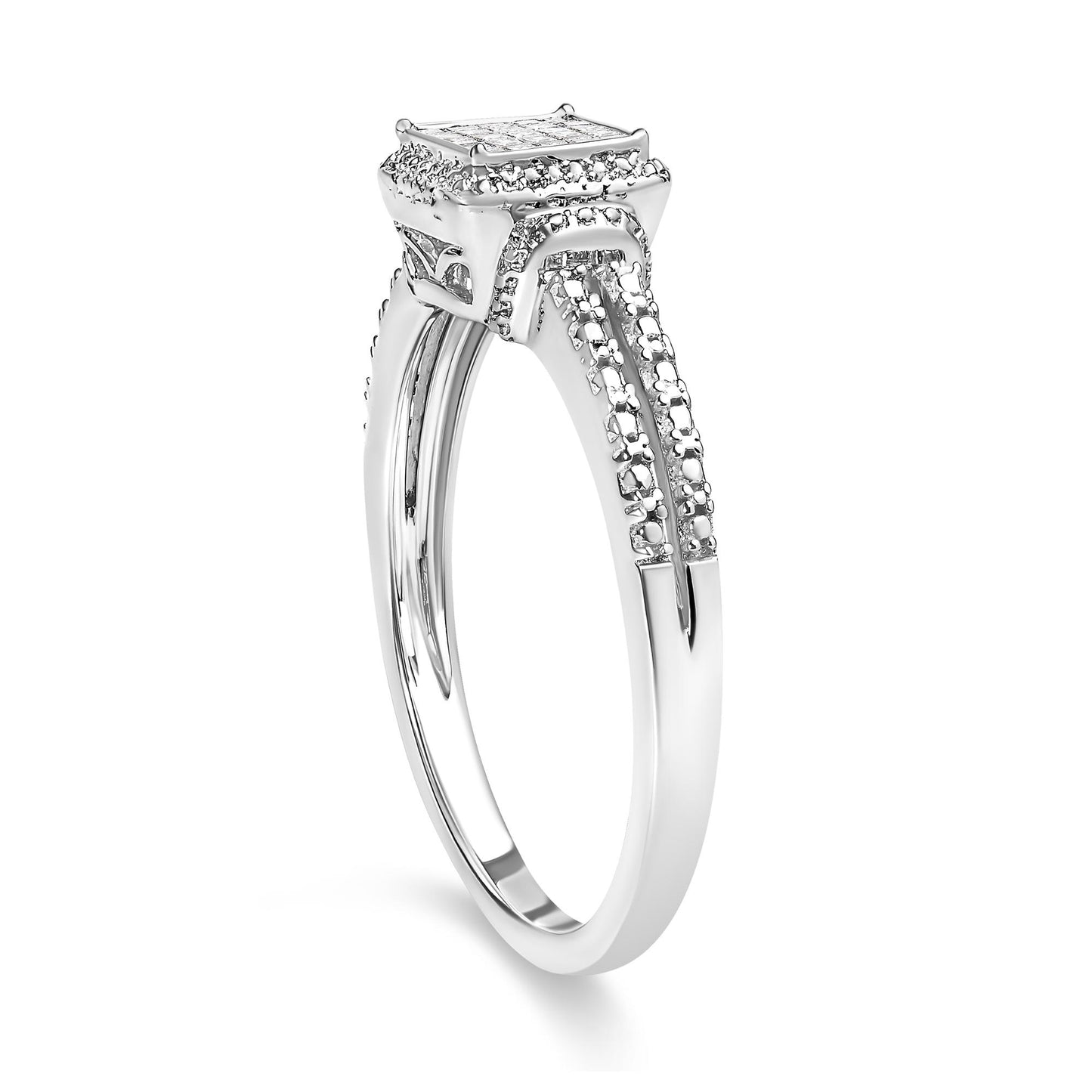 White metal ring viewed from a three-quarter angle, featuring a square cluster of princess-shaped white gemstones in an invisible setting and additional small white gemstones along the band.