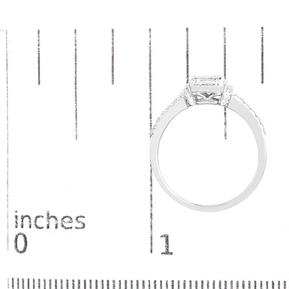 White ring with princess-shaped white gemstones in invisible setting viewed from the side, placed on a ruler for size reference.