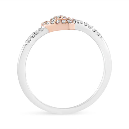 Rose metal ring with round white gemstones in prong setting around the band, side profile view on white background.