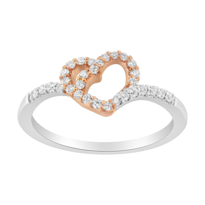 Front angle of a white and rose metal ring featuring a rose-colored heart outline adorned with round white gemstones in prong settings, with additional round white gemstones set along the white band.