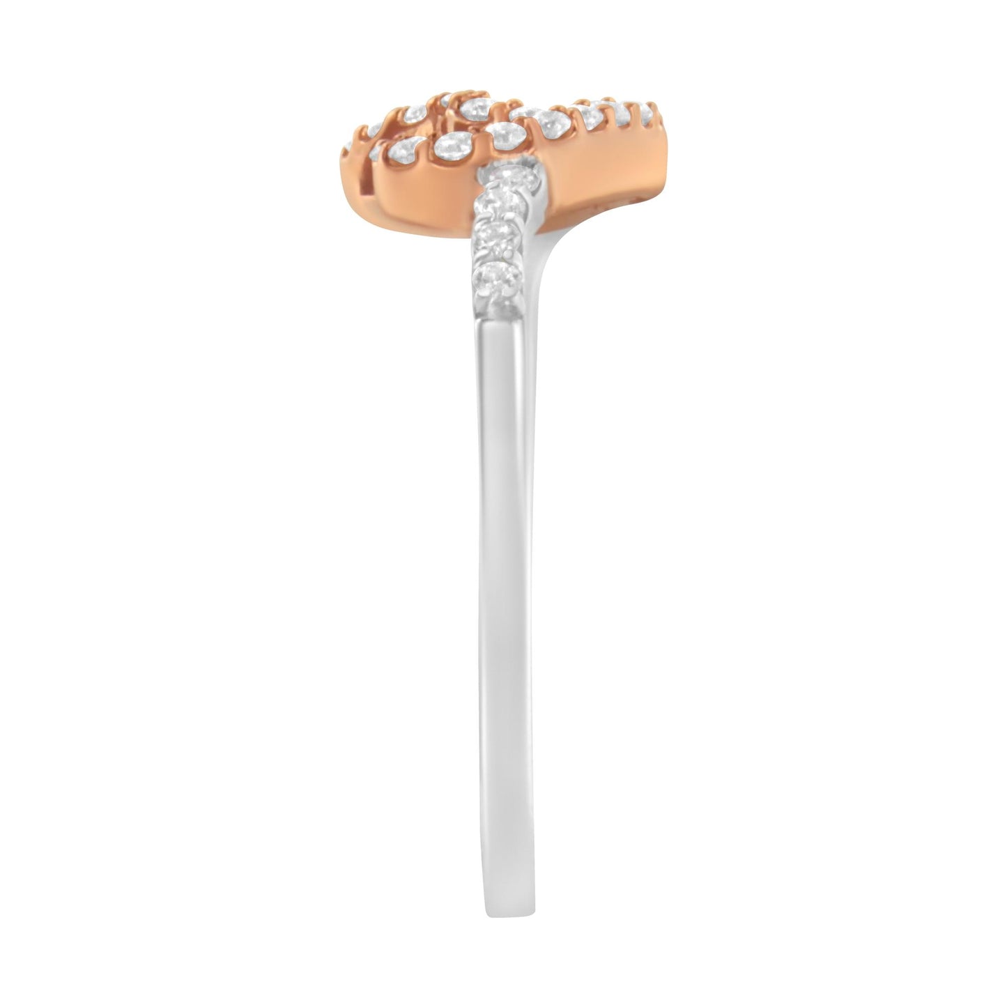 Side view of a ring with a white band and a rose-colored top adorned with multiple white round gemstones in prong settings.