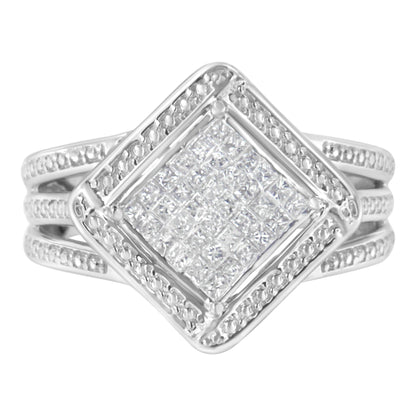 Front-facing view of a white metal ring featuring a square cluster of princess cut white gemstones in an invisible setting, surrounded by smaller white gemstones on a split band.