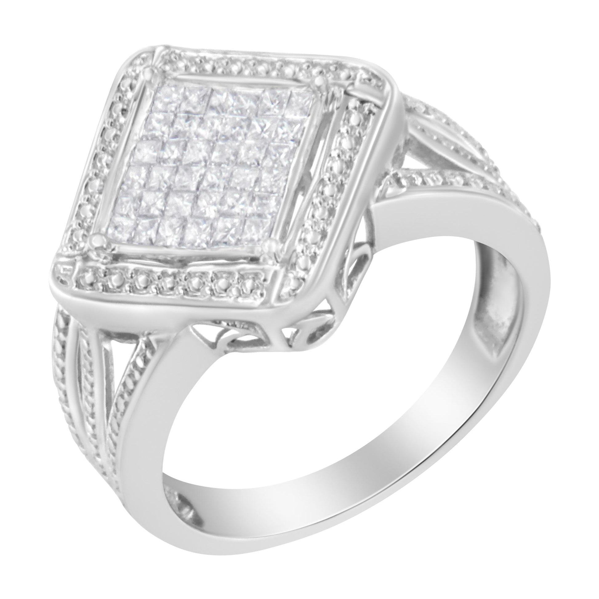 Close-up angled view of a white metal ring featuring a square cluster of princess-shaped white gemstones in an invisible setting, surrounded by smaller white gemstones on the band.