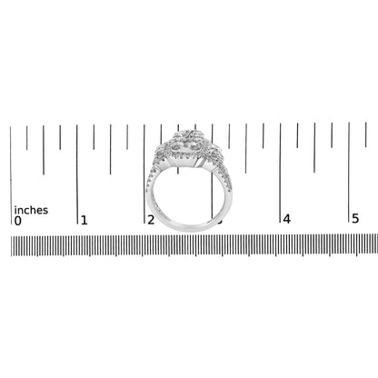White metal ring with multiple prong-set white round gemstones viewed from the front, positioned on a ruler for size reference.
