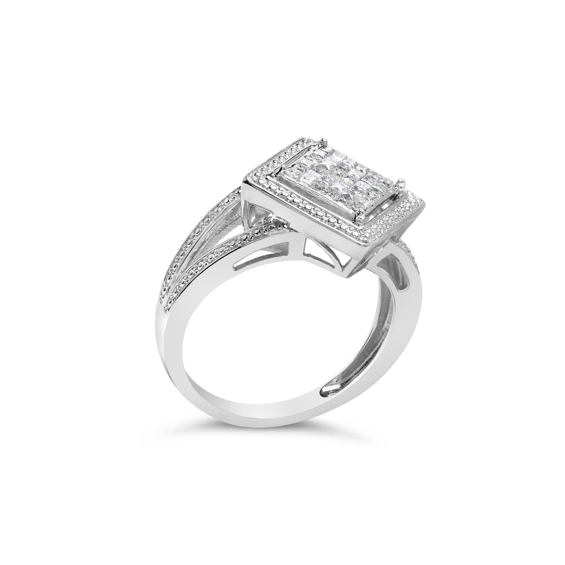 White metal ring with a rectangular cluster of white princess-shaped gemstones in an invisible setting, shown from a side angle.