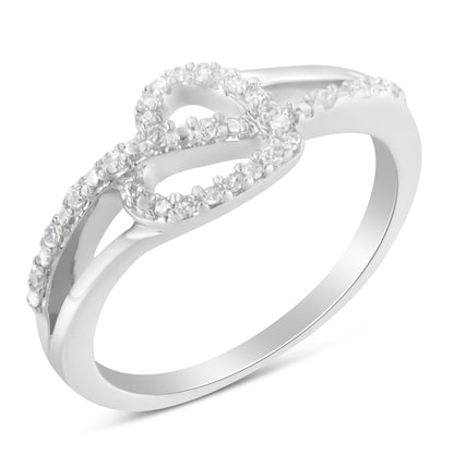 White metal ring with an infinity loop design adorned with round white gemstones in prong settings, shown from a slightly angled top view.