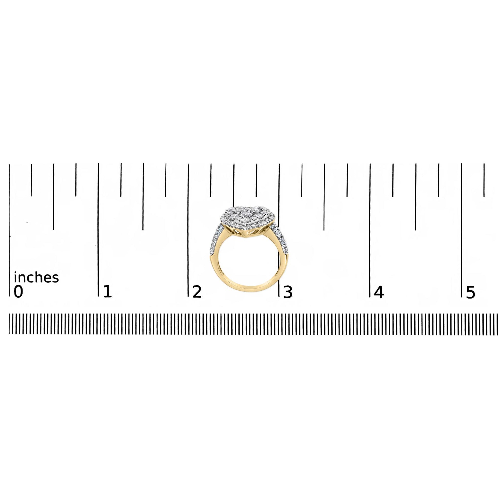 Yellow metal ring with a cluster of round white gemstones in prong settings viewed from the side, placed on a ruler for size reference.