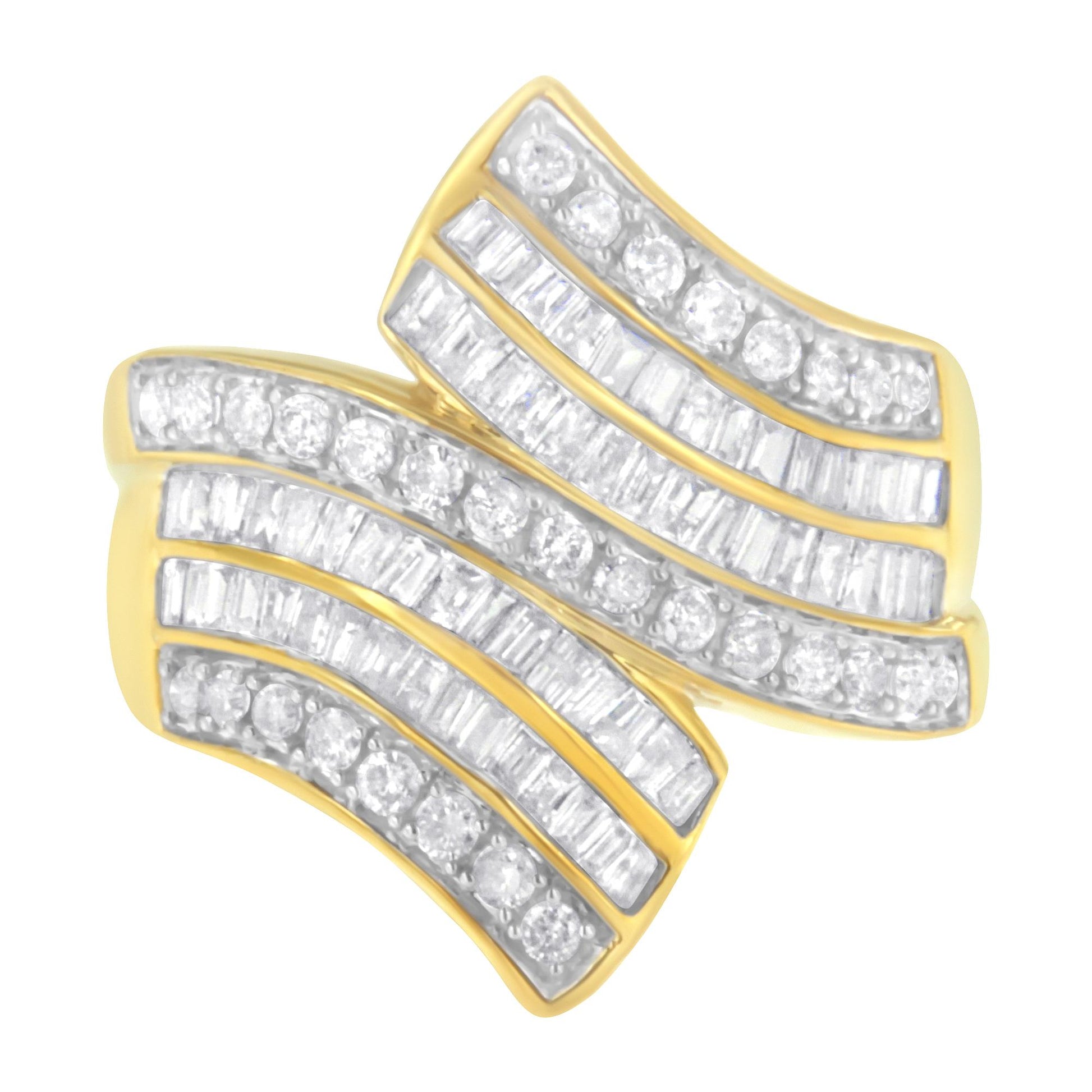 Yellow ring with curved design, set with multiple rows of round and baguette white gemstones, shown in a top-down angled view.