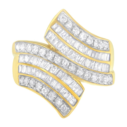 Yellow ring with curved design, set with multiple rows of round and baguette white gemstones, shown in a top-down angled view.