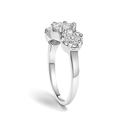 White metal ring with two clusters of round white gemstones in prong settings, shown at a slight angled side view.