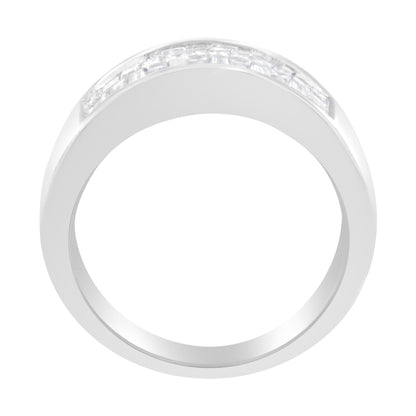 Top-down view of a white metal ring featuring channel-set white baguette and princess shape gemstones across the upper band.