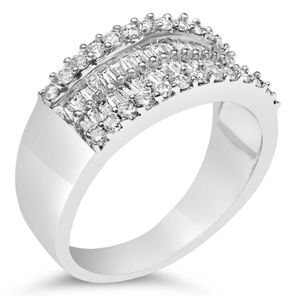Close-up front angled view of a white metal ring with rows of round white gemstones in prong settings and baguette white gemstones in channel settings across the top.