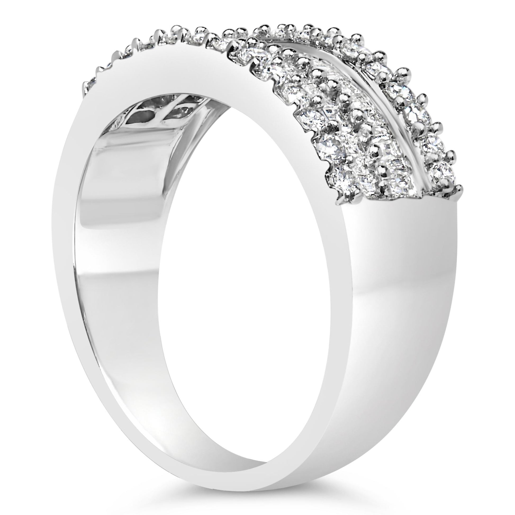 White metal ring with round prong-set white gemstones and baguette channel-set white gemstones, shown in a side angle view.