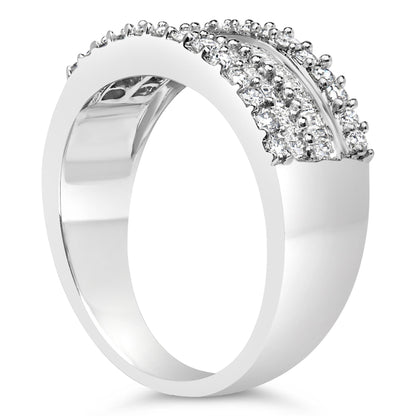 White metal ring with round prong-set white gemstones and baguette channel-set white gemstones, shown in a side angle view.